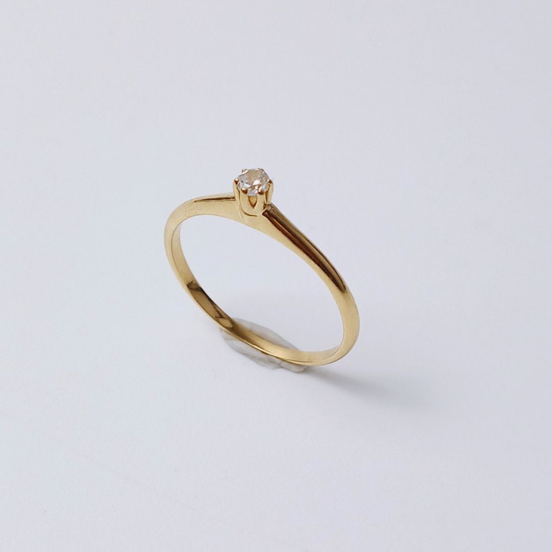 Anel Tiffany 5 pts em ouro 18k.