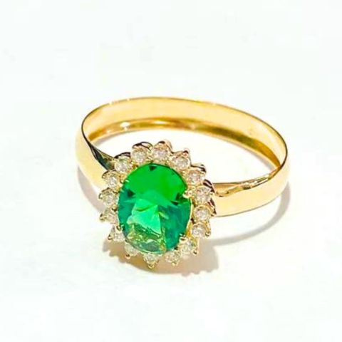 Anel Megan com 1 pedra oval 6X8 mm e 16 de 1,5 Pts.